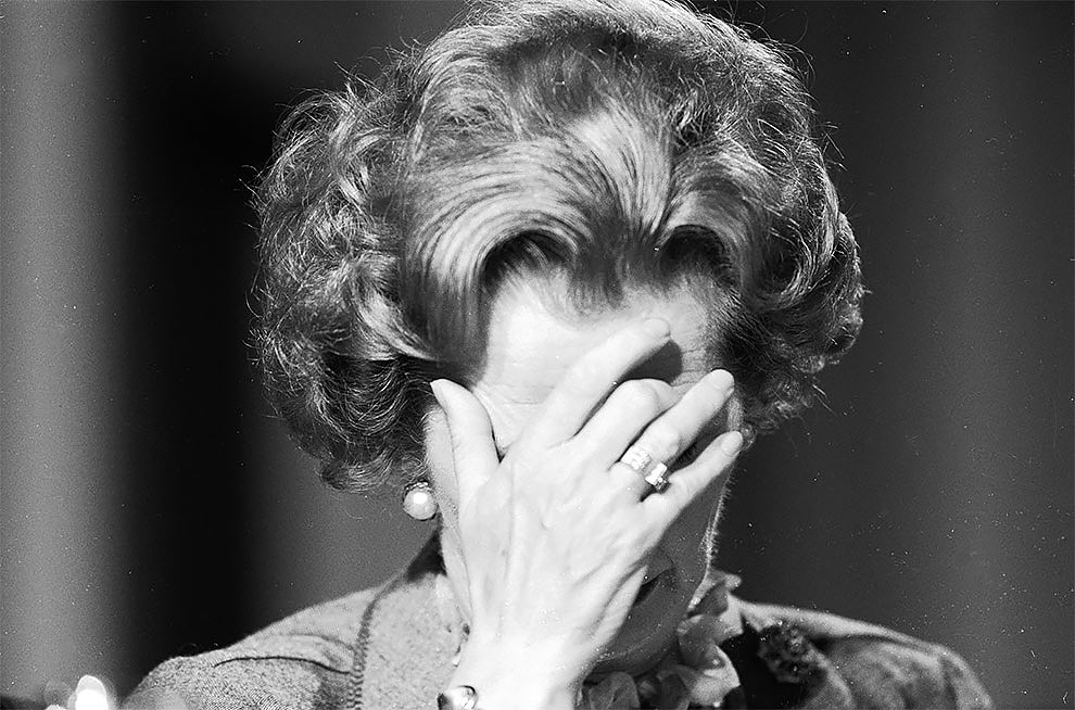 British prime minister Margaret Thatcher covering her face with her hand at the 1985 Conservative Party Conference.jpg